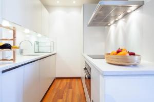 a kitchen with a sink and a counter top at Inside Barcelona Apartments Mercat in Barcelona