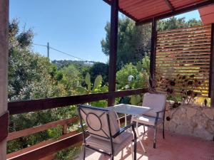 a table and two chairs on a patio with a view at La Dimora dei Pescatori in Vieste