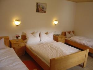 Postel nebo postele na pokoji v ubytování Pension Bergblick