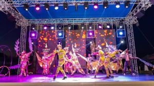 a group of people dancing on a stage at Amon Hotels Belek - Adult Only in Belek