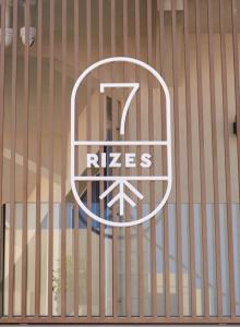 a metal fence with a rieses sign on it at 7Rizes Luxury Living in Heraklio