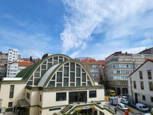 a building with a domed roof in a city at Piso céntrico 2 habitaciones a escasos metros de Maria Pita in A Coruña