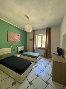 A bed or beds in a room at Casa Impagliazzo