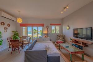 a living room with a large bed and a table at Golden Apartments El Gouna in Hurghada