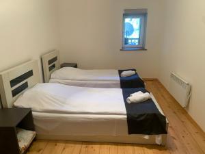 Postel nebo postele na pokoji v ubytování Hotel Lemi