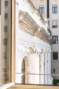 a view of a building through a window at Hotel Dei Dragomanni in Venice