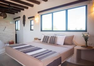 Postel nebo postele na pokoji v ubytování Villa Los Mangles Boutique Hotel + 37 fotografií