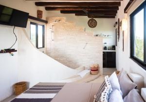 Postel nebo postele na pokoji v ubytování Villa Los Mangles Boutique Hotel