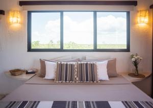 Postel nebo postele na pokoji v ubytování Villa Los Mangles Boutique Hotel