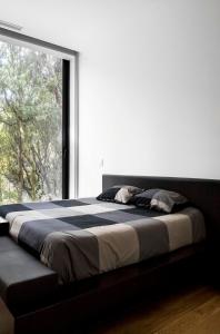 Postel nebo postele na pokoji v ubytování Casa do Ancoradouro