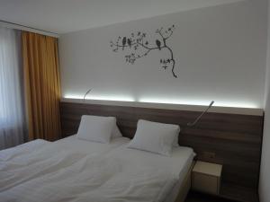斯布嫩斯哈佛利酒店客房内的一张或多张床位