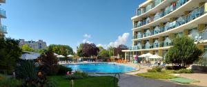 a swimming pool in front of a large building at Julia Family Apartments in Sunny Beach +26 photos