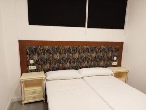 Ein Bett oder Betten in einem Zimmer der Unterkunft Hello Madrid