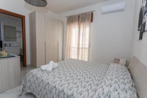 Postel nebo postele na pokoji v ubytování B&B La Barcaccia