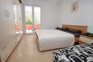 Postel nebo postele na pokoji v ubytování Apartments Villa Dalmazia