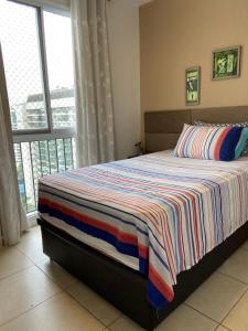 Rúm í herbergi á Apartamento Moderno - Barra da Tijuca