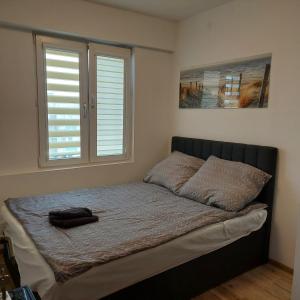 Posteľ alebo postele v izbe v ubytovaní Apartament MIRA