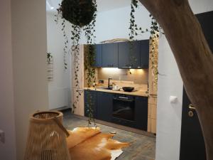 a kitchen with blue cabinets and a counter top at Lieblingsnest in Schwerin