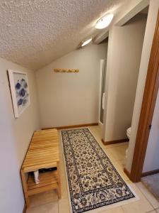 a room with a table and a rug at Treehouse Condos - Branson in Branson