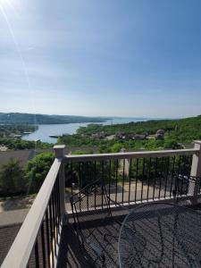 a balcony with a view of a river at Treehouse Condos - Branson in Branson