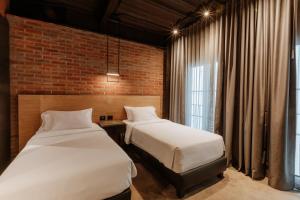 Postel nebo postele na pokoji v ubytování The Art Hotel Medellin