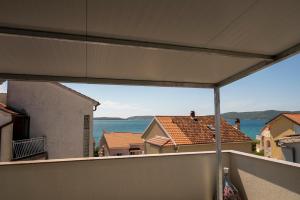 a view of the ocean from a balcony at Apartment Onix in Brodarica