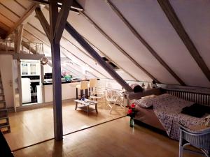a bedroom with a bed in a attic at Deki & Kolet in Belgrade