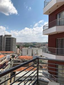 a view of a city from a balcony of a building at Tropical Palace Hotel in Lavras