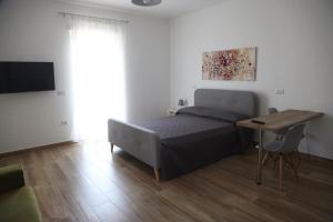Postel nebo postele na pokoji v ubytování Le Suite del Pastore