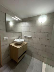 a bathroom with a sink and a mirror at Casa Vacanze Linuccio in Casalabate +22 photos