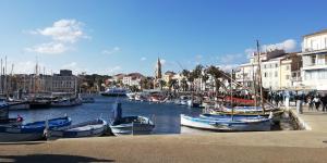 a group of boats are docked in a harbor at L'Escale d'Aubagne votre refuge chaleureux pour un séjour relaxant in Aubagne