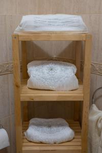 a wooden shelf with two white pillows on it at Sunset Resort in Aiándion