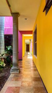a hallway of a building with colorful walls at Art 57 Hotel - Adults Only in Mérida