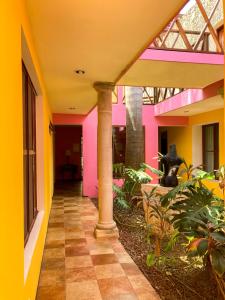 a hallway of a house with colorful walls at Art 57 Hotel - Adults Only in Mérida