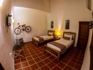 Postel nebo postele na pokoji v ubytování Hotel Brisas La Gaviota Mariquit-Tolima