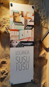 エンナにある"Locanda Susuiusu" keyless entryの鮨の信頼を壁に読み取る印