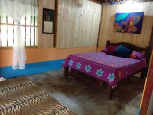 Postel nebo postele na pokoji v ubytování Ecohotel Arte y Aventura