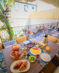a table with plates of food on it at 9 Alacati Boutique Hotel in Alaçatı