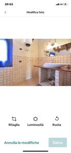 Captura de pantalla de un baño con encimera y lavabo en VENTO DI FANUSA en Fanusa
