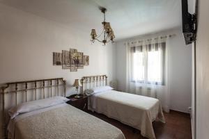 Postel nebo postele na pokoji v ubytování Casa Rural La Fontanita