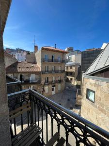 a view of a city from a balcony at Moderno estudio en Porta Do Sol in Vigo