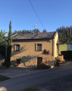 a house on the side of a street at La Casa del Castaño in Vegadeo