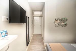 A television and/or entertainment centre at Scipioni Best Rooms