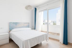 Posteľ alebo postele v izbe v ubytovaní Maravilloso adosado junto a la playa + 21 fotografií