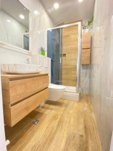 a bathroom with a toilet and a sink and a shower at Apartment Lana in Baška Voda +19 photos