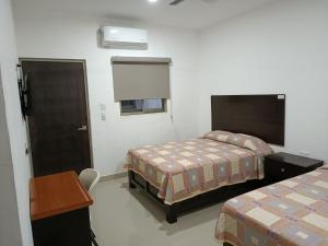 Postel nebo postele na pokoji v ubytování Hotel Romo