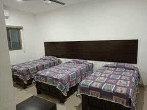 Postel nebo postele na pokoji v ubytování Hotel Romo