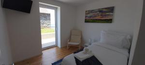 Postel nebo postele na pokoji v ubytování House Nobrega of Madeira + 37 fotografií