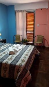 Una cama o camas en una habitación de Córdoba Te Espera