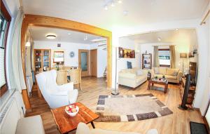 a living room with a couch and a table at Ferienhaus 11 In Kirchheim in Kirchheim